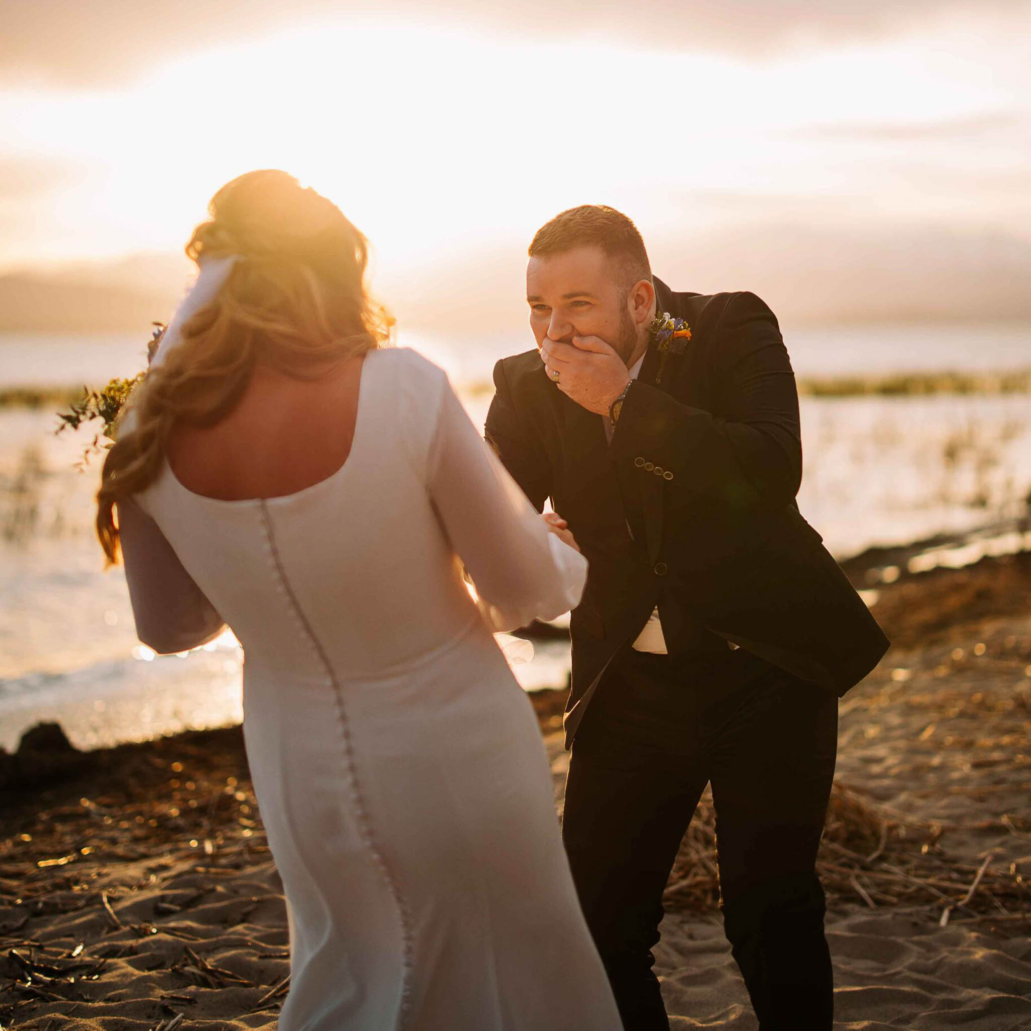 first look session between bride and groom utah lake golden hour. hawkins photo and film utah engagement photographer utah wedding photographer