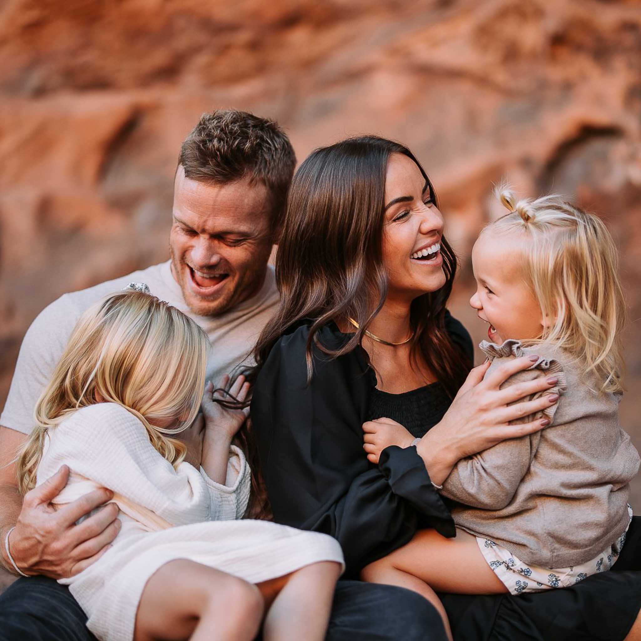 young family posing for family photos ired cliffs spanish fork utah golden hour in a golden field. hawkins photo and film family photography