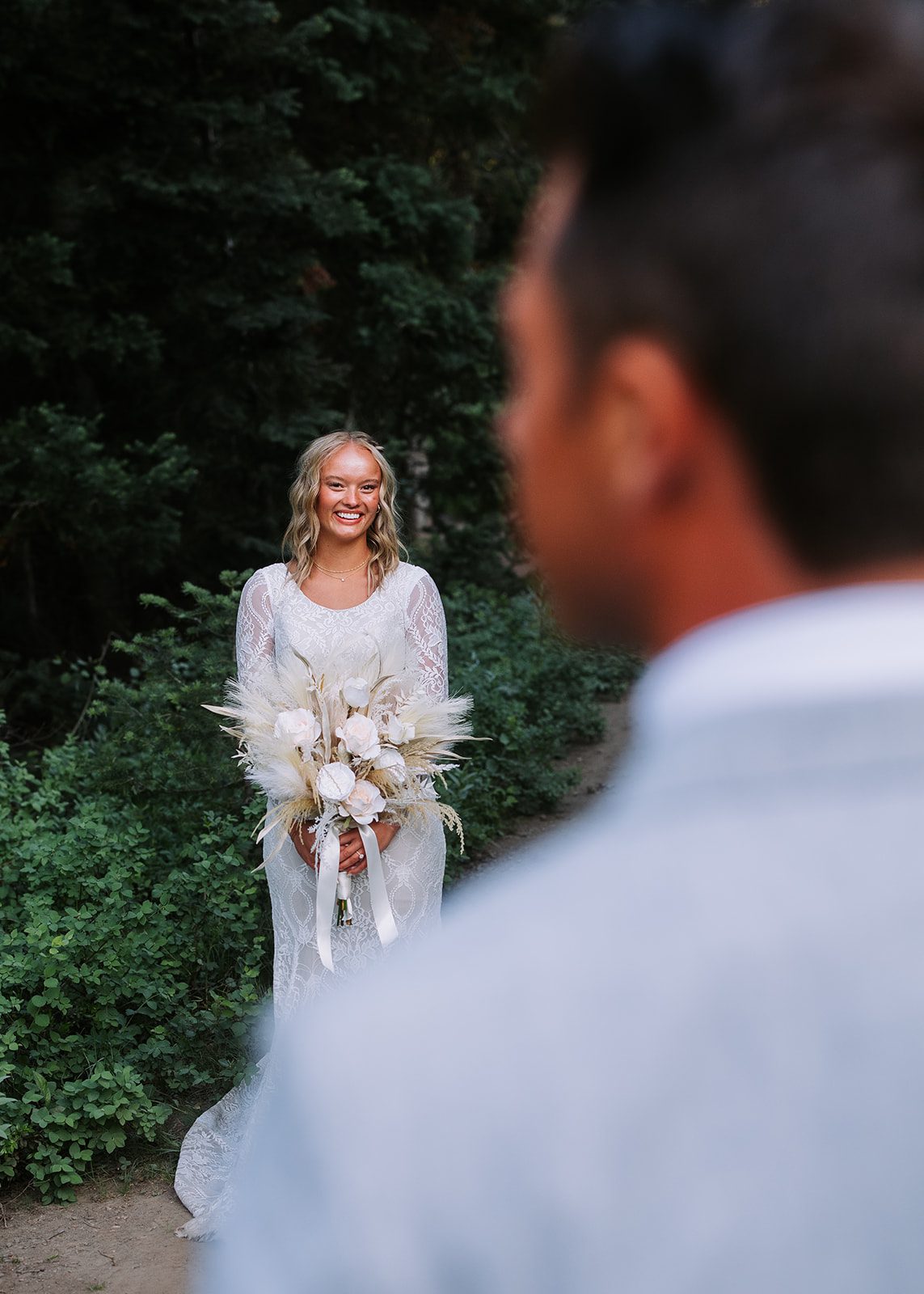bride and groom first look at Jordan Pines Utah surrounded by pine trees during golden hour