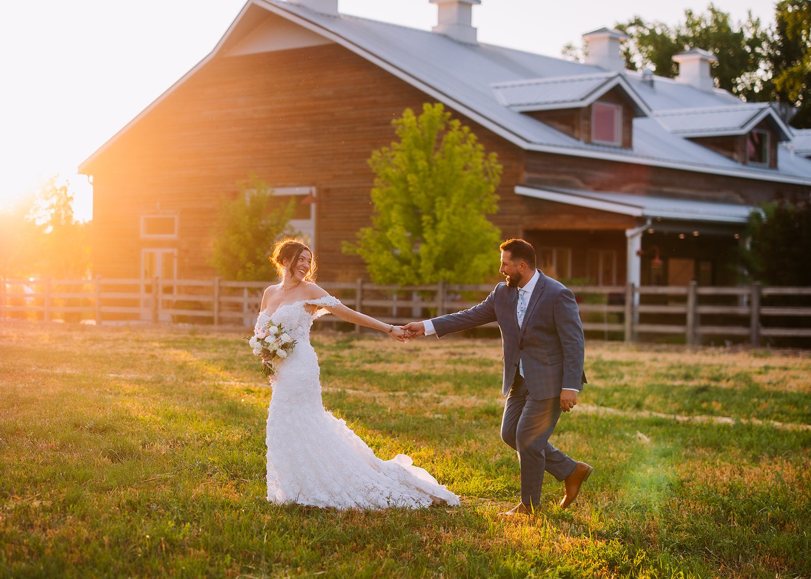 Cinematic shot of wife leading her husband through a lush green field in autumn in spanish fork utah and river bridge event center