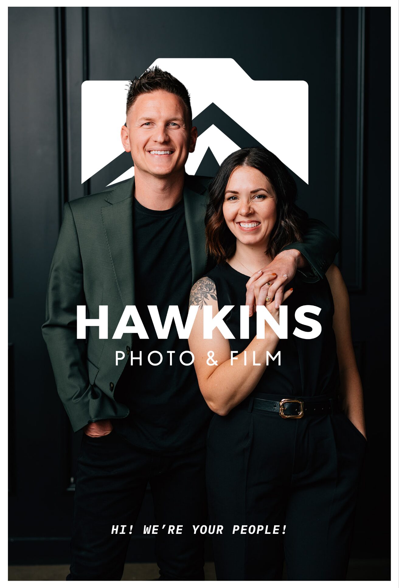 a husband and wife duo posing infront of a camera at a studio promoting themselves for business